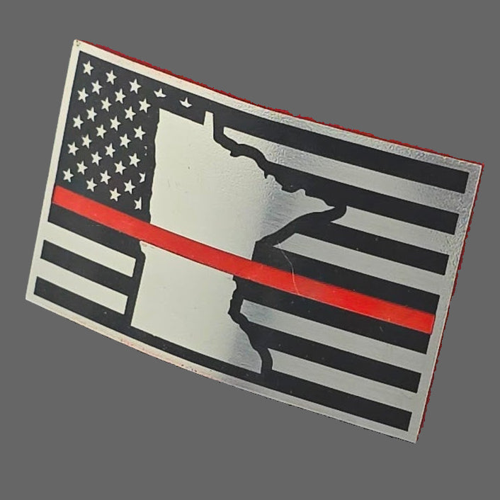 An acrylic patch in stainless/black/red with American flag and Minnesota state design on a light gray background